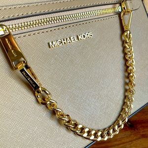 Brand NEW Michael Kors crossbody purse in Camel with gold hardware.